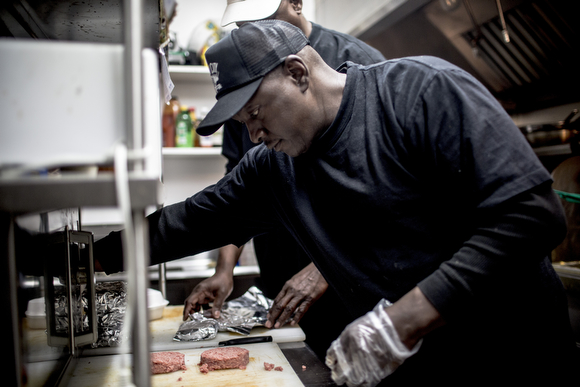 Owner Nathan Strong works in the kitchen.