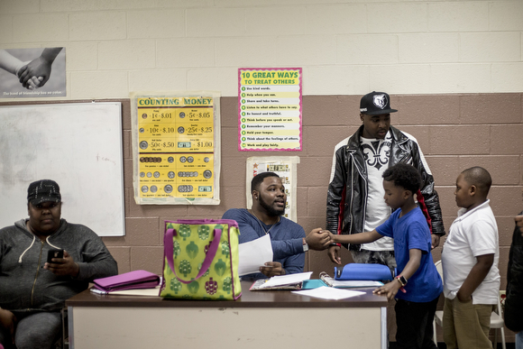 Chavis Daniels chats with kids interested in the North Memphis Steelers peewee football team during a meet-and-greet at the Dave Wells Community center in Smokey City. 