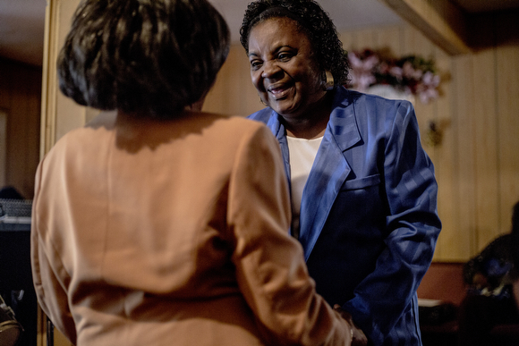 Vera Landers greets Jerry Darling at Pillar of Jerusalem church in Smokey City. 