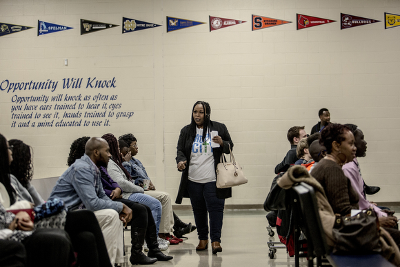 Folks find their seats during Sunday service at Hope City Church in Caldwell-Guthrie's cafeteria in Smokey City. 