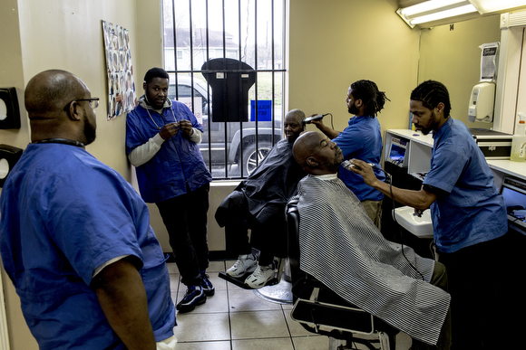 Students give clients haircuts at The Barber School on Jackson Avenue in Klondike. 