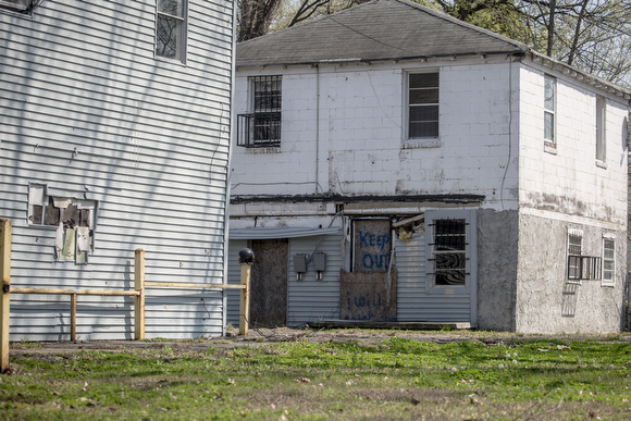 A boarded up home on Bellevue Boulevard in Klondike carries a message to deter break-ins. 