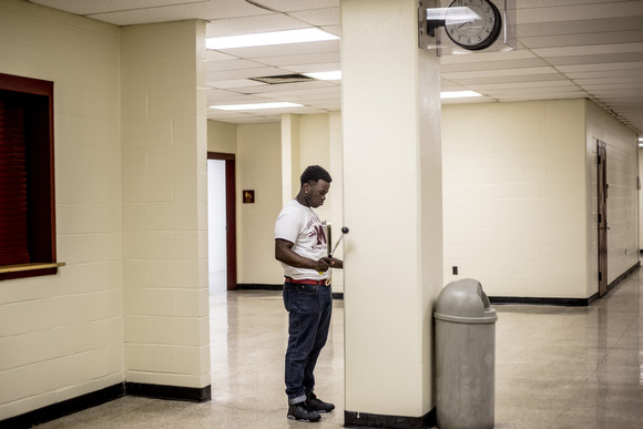 A member of the Melrose High School band warms up for his performance at a fundraiser for the band in March.