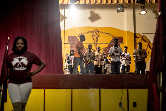 The stage curtains open for the Melrose High School band's performance at a fundraiser in March.