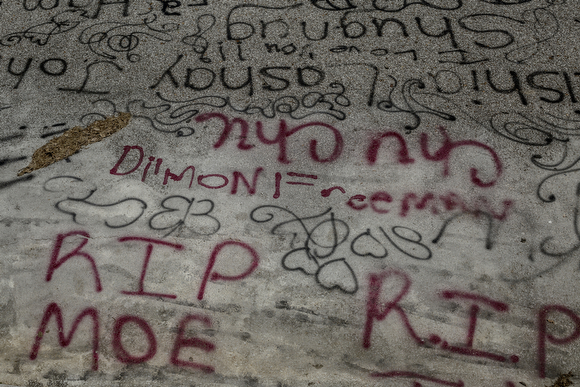 Names and remembrances were spray painted on the ground near one of the playgrounds on the west side of Foote Homes.