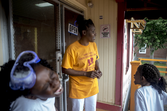 Jada Jordan (right), 10, laughs after telling Barbara Nesbit a joke at the Vance Avenue Youth Development Center. 