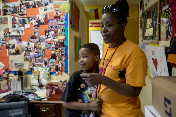 Barbara Nesbit hangs out with the kids at the Vance Avenue Youth Development Center. 