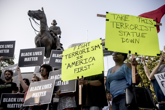 Folks gather at Health Sciences Park at the Memphis event held in solidarity with Charlottesville following the Aug. 12 events that included white supremacist rallies and violence against counter protesters.