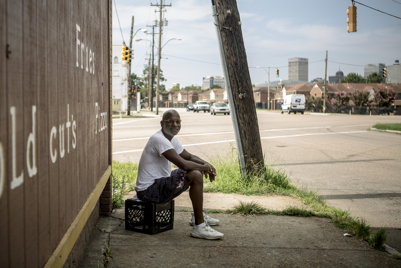 Demetrius Triplett hangs out outside of the Friendly Food Mart on the corner of Danny Thomas and Mississippi Avenue. It closed earlier in the summer after business slowed down following the shutting down and demolition of Foote Homes.