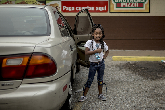 Aja pauses for a portrait while at A-1 Speedy Corner while on a trip with her mom. 