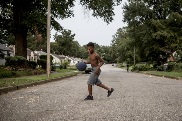 A game of basketball along Radford Road in Orange Mound.