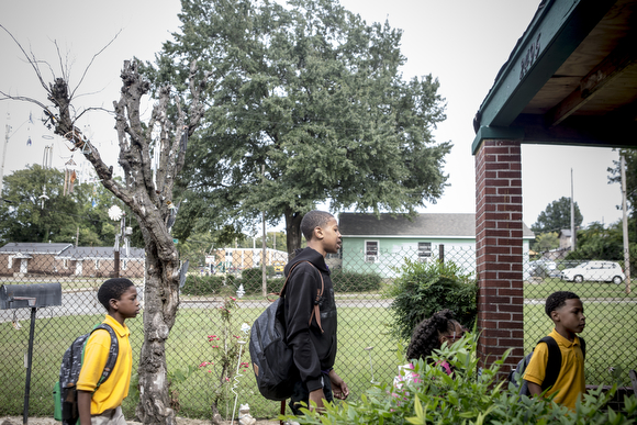 Kids start lining up at the home of Deidra Tuggle, the Candy Lady of Orange Mound.