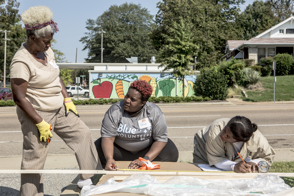Folks from Blue Cross Blue Shield of Tennessee, the school, St. Andrew's Church and neighbors from nearby businesses came out to work together and get the project finished in time for Friday's grand opening. Download permissions