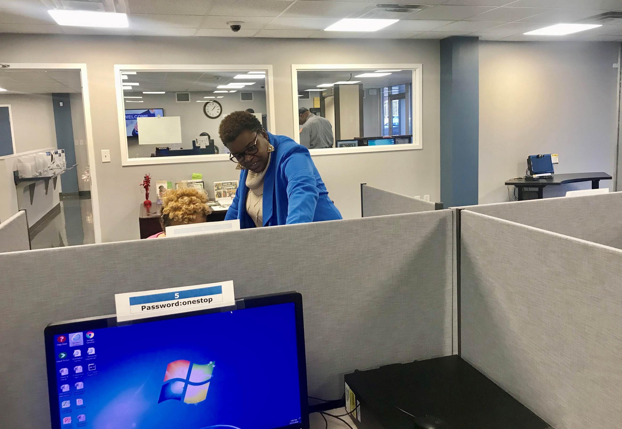 Tameka D. Greer, project director for the Career Advantage Youth Program assists a young person in an online job hunt. The program works with people ages 16 to 24 to identify and manifest their professional goals. (Felicia Christian)