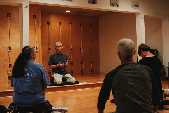 Dan Lamontagne (center) leads a meditation class at the Evergreen Yoga Center. 
