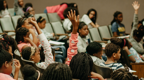 A watchful audience during the Envision Lead Grow summer camp.