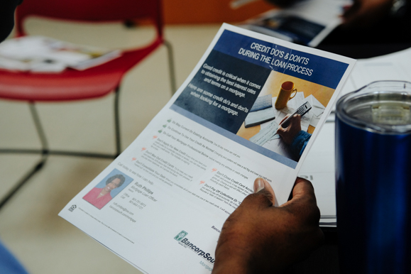 A Job Corps student reviews a credit strategy brochure during a class being led by BancorpSouth. (Brandon Dahlberg)