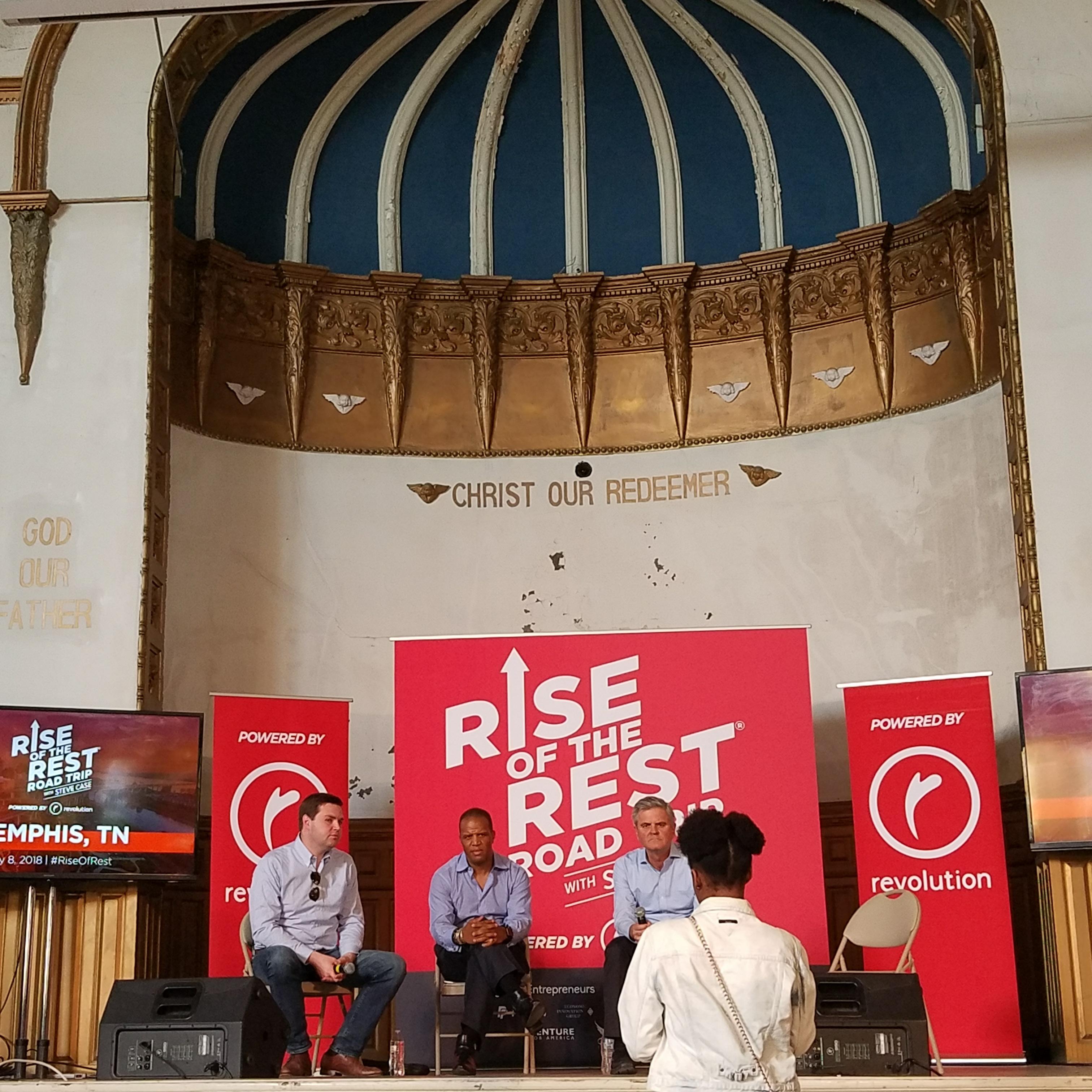 A Memphis resident speaks to J.D. Vance, John Hope Bryant and Steve Case at the May 8 Rise of the Rest pitch competition. (Madeline Faber)
