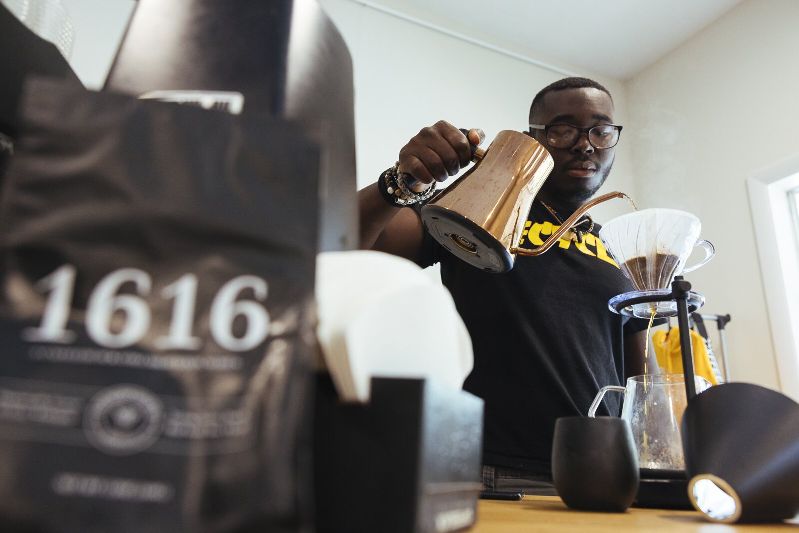 Monterrion Webber makes a cup of coffee for a patron of Cxffeeblack at the Anti-Gentrification Coffee Club #1, located at 751 National Street in The Heights. (Ziggy Mack)