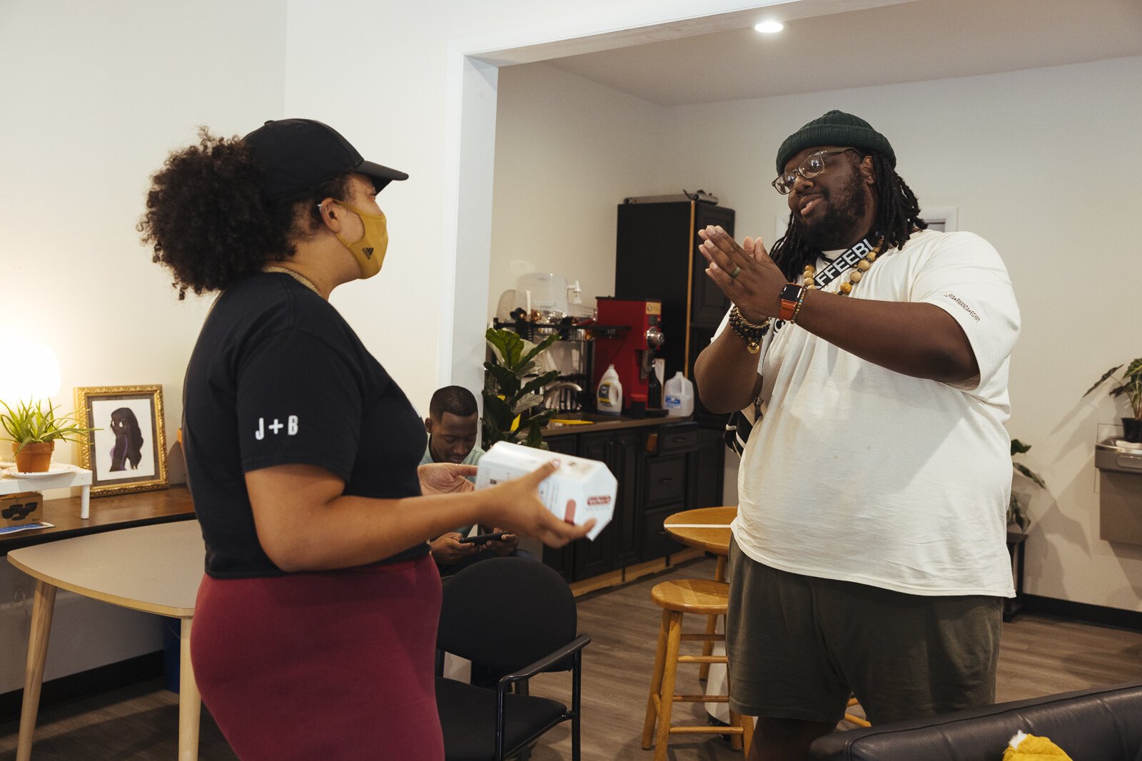 Co-founder Bartholomew Jones talks with a customer at Cxffeeblack's Anti-Gentrification Coffee Club #1, located at 751 National Street in The Heights. (Ziggy Mack) 