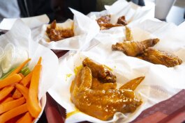 At D'Bo's Wing n' More, the wing challenge tasters sampled regular hot, suicide hot, honey gold, and seasoned wings. (Ziggy Mack)