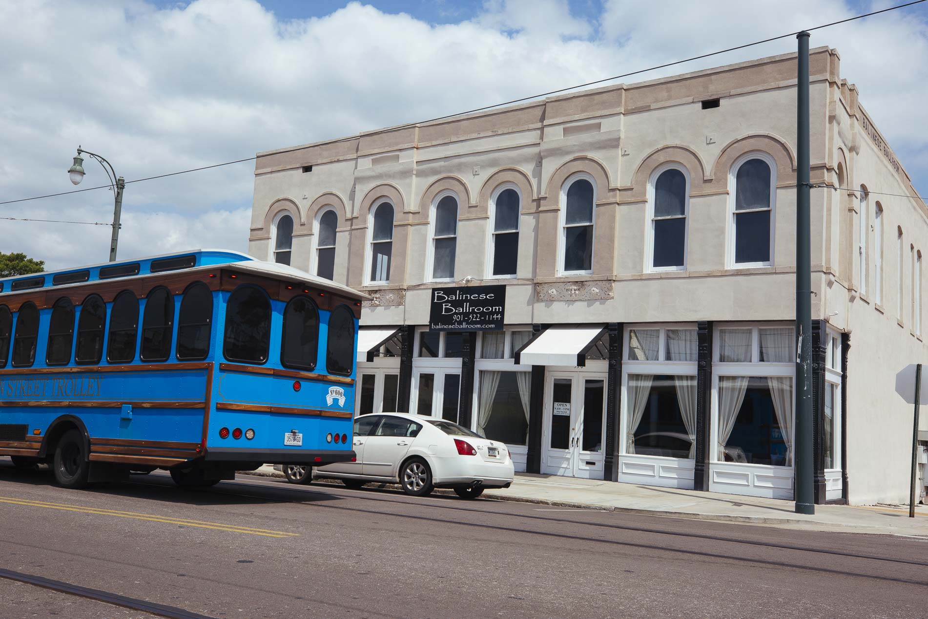 A Memphis bus trolley passes in front of the Balinese Ballroom in the Pinch District. (Ziggy Mack)