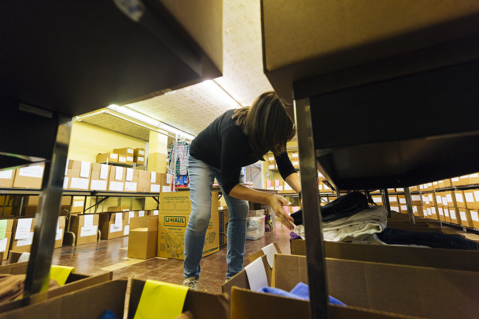 Catholic Charities volunteer Julie Ledet organizes clothing which is to be donated to Memphis' homeless and impoverished community. (Ziggy Mack) 