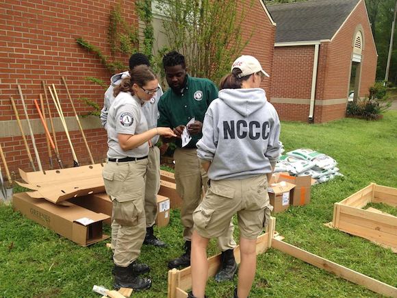 Americorps NCCC volunteers build raised beds at Charles Powell Community Center