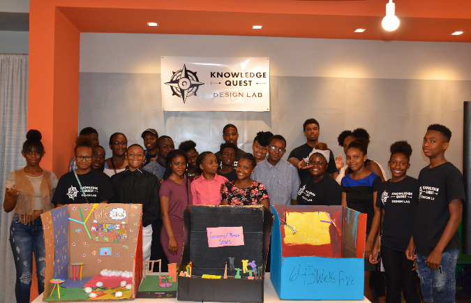 Participants in the summer camp show off some of their 3D models for neighborhood revitalization.
