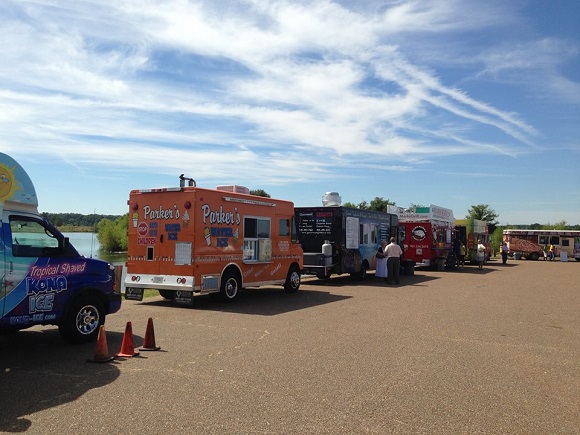A line of local food trucks at Shelby Farms