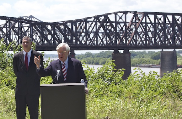 Charlie McVean addresses the press conference with the Harahan Bridge in the background