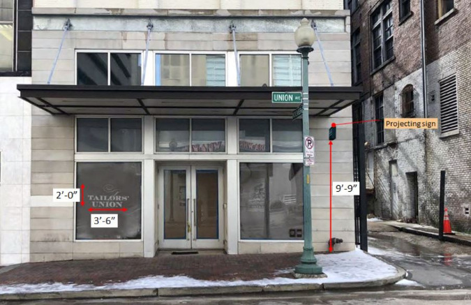 The ground-floor commercial space will receive exterior improvements and a more inviting alley presence before opening.