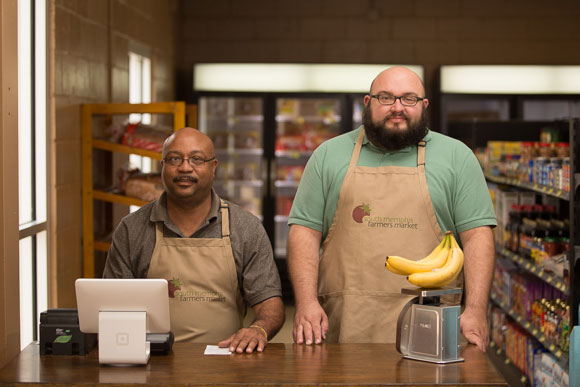 Grocer manager Devin Marzette with Curtis Thomas