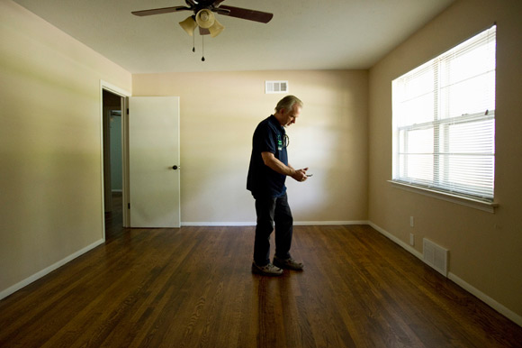 Lockwood checks on a house on Nunnelee Ave. in Frayser that has recently been rehabbed by his organization