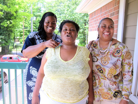  Kenzie (center), posing with two of her case workers, gets her apartment through Memphis Strong Families, a program designed to keep children of homeless families out of foster care