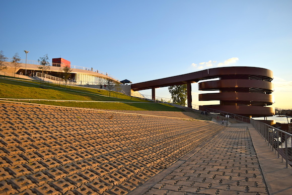 The striking design, by RTN Architects of Buenos Aires, Argentina, features an undulating grass roof and a red helical ramp