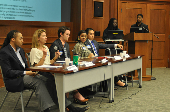 Alton Cryer (at podium) hosts a panel discussion at the U of M that brings together professional leaders of Memphis and young college students