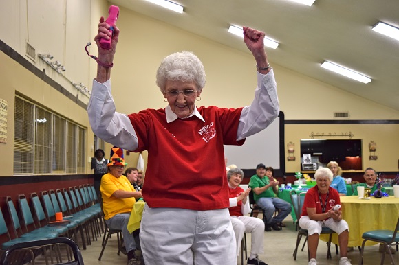 Low-income seniors compete in a Wii Bowling tournament sponsored by the Golden Cross Senior Residents Fund.