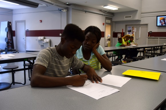 Incoming freshman Nathaniel Crawford registers for classes with the help of his mother, Daphne; school started on August 4th
