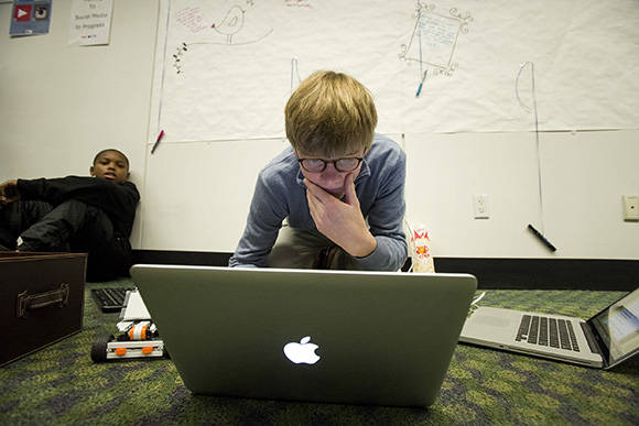 In the crowdfunded teen tech lab, Macon Orr, 15, grabs a moment to work on programming for a Bluetoo