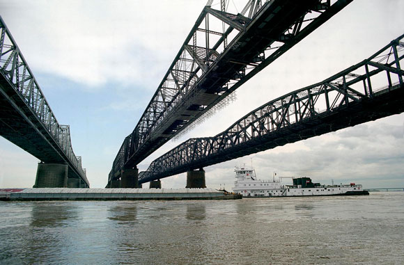 A barge passes across the Mississippi River. 