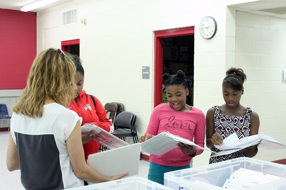 Angel Street founder and executive director Jill Dyson and students prepare for choir rehearsal at Bickford Community Center