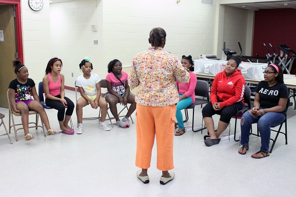 Angel Street Choir Director Angela Hyde begins rehearsal with students in the program