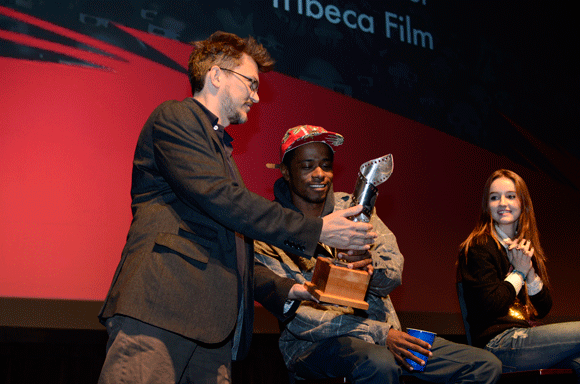 Indie Memphis Executive Director Erik Jambor awards actor Keith Stanfield and actress Kaitlyn Dever 