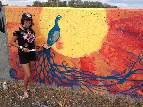 Former Memphian Beth Warmath came from Florida to join over 150 artists in painting the largest collaborative mural in Tennessee