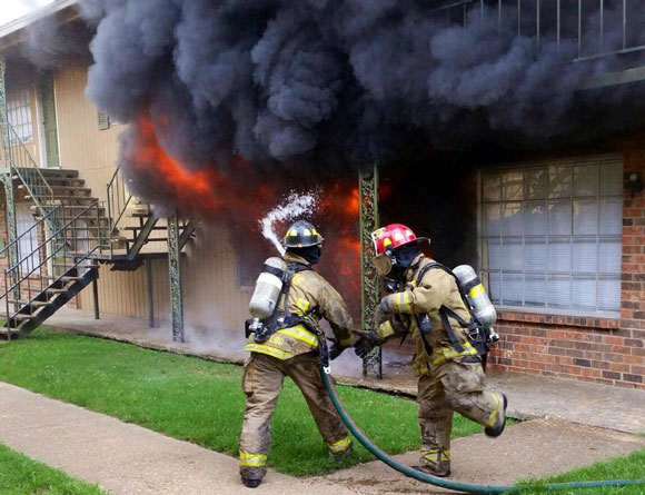 Memphis firefighters battle a blaze in Frayser on September 6