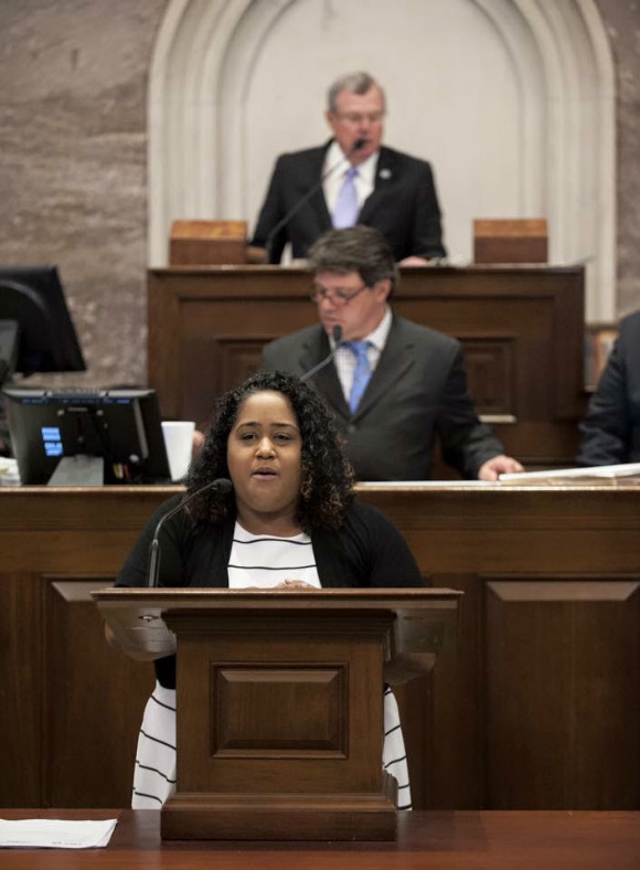  Rep. Akbari speaks in front of the state legislature.