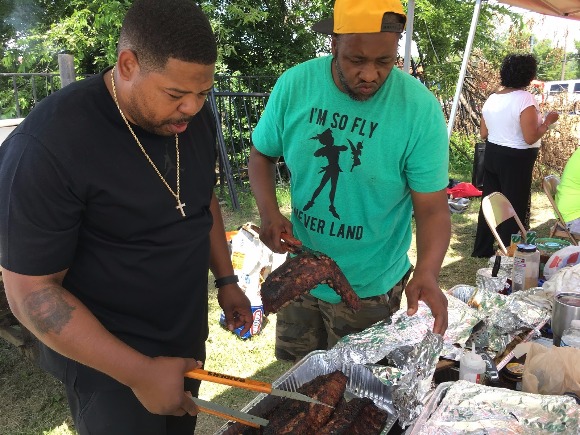 Anthony Jackson (L) and Rico Randall (R) showing off their award-winning barbecued ribs