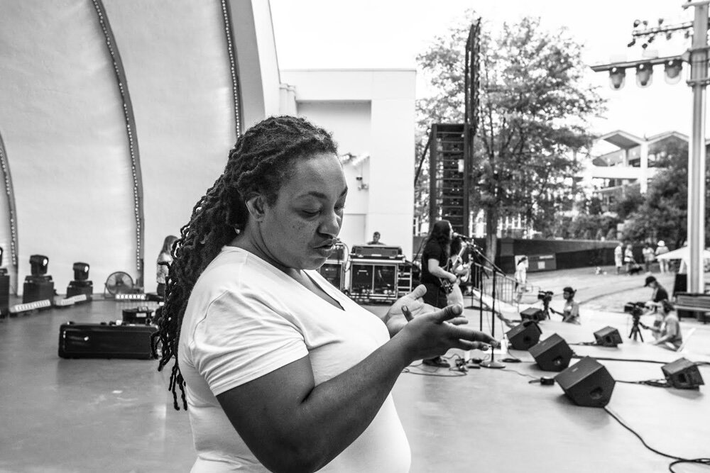 ASL interpreter Erin Otey onstage at the Overton Park Shell.