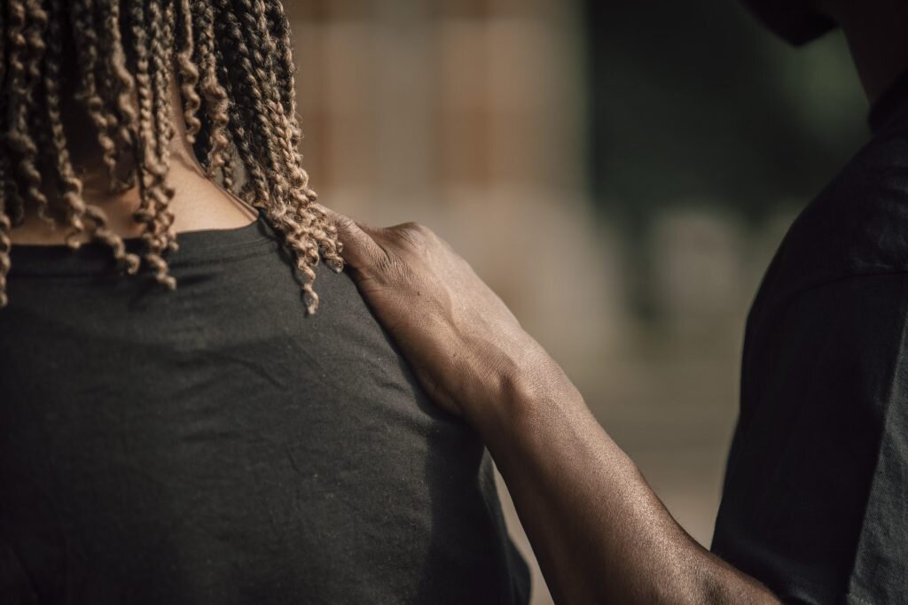 June 20, 2020. One participant comforts another during a moment of silence at the “Our Now, Our Future” march for Black children at Overton Park. About 200 hundred people showed up in solidarity. (Andrea Morales for MLK50)